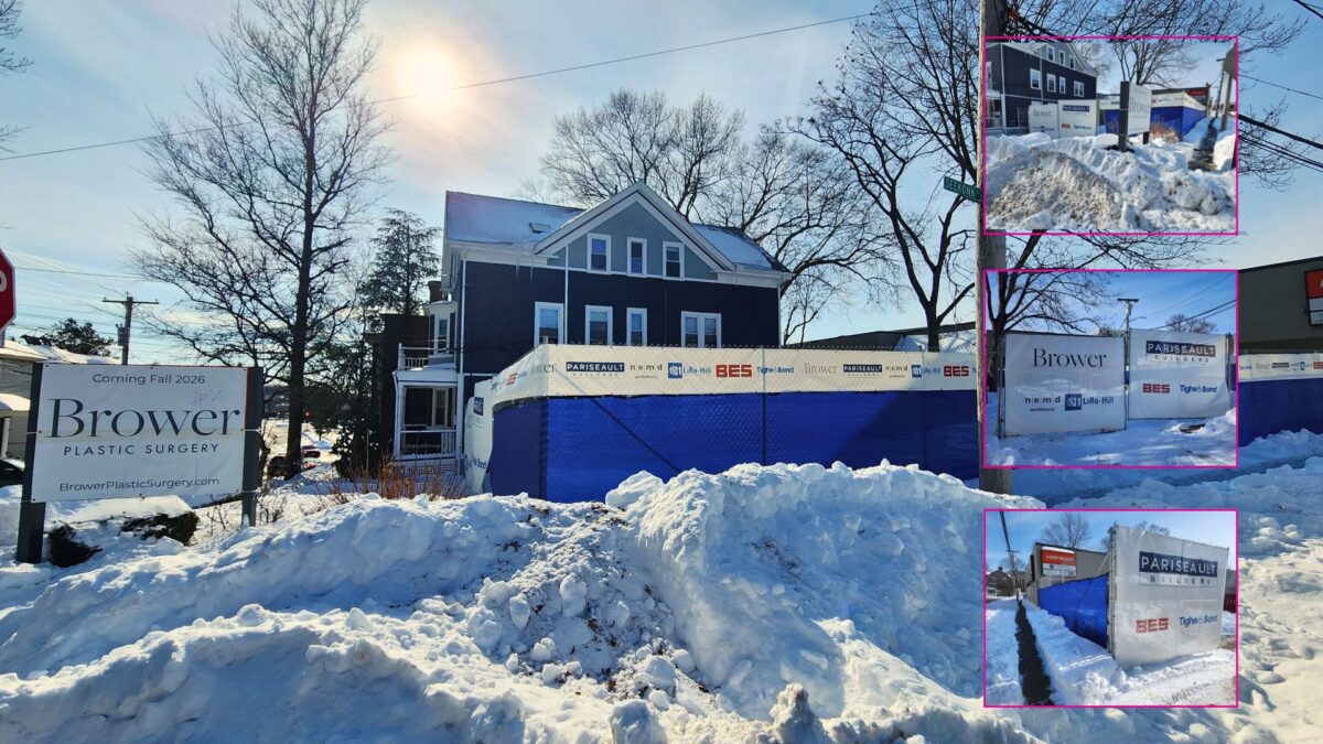Snow-covered construction site outside a dark blue two-story house with signage reading “Brower Plastic Surgery – Coming Fall 2026” and branded fencing for Pariseault Builders and other partners, photographed on a sunny winter day with large snowbanks and bare trees.